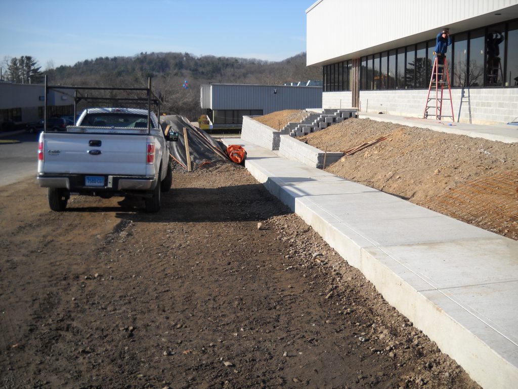 Freshly paved sidewalk at a new building