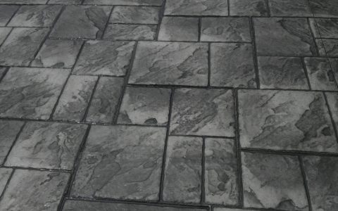 A dark ashlar slate concrete pattern