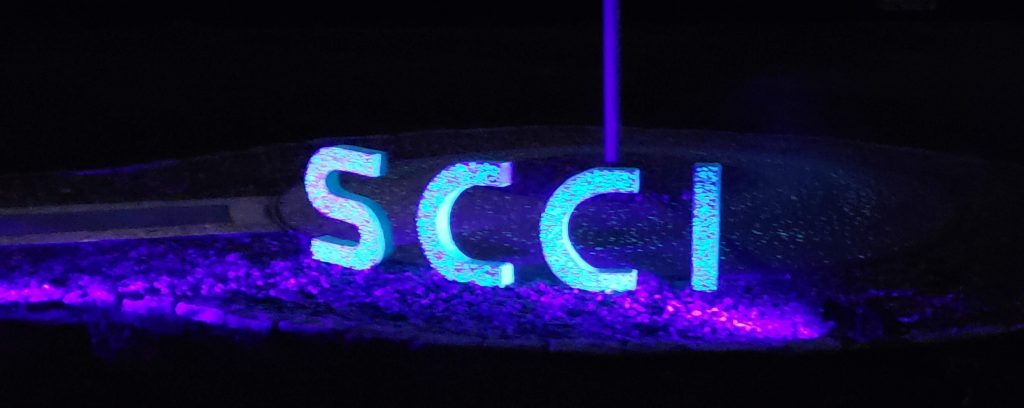 SCCI spelled with glow-in-the-dark concrete letters